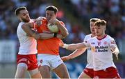 3 June 2023; Stefan Campbell of Armagh is tackled by Tyrone players, from left, Ronan McNamee, Michael O’Neill and Conor Meyler during the GAA Football All-Ireland Senior Championship Round 2 match between Tyrone and Armagh at O'Neill's Healy Park in Omagh, Tyrone. Photo by Brendan Moran/Sportsfile