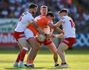 3 June 2023; Stefan Campbell of Armagh is dispossessed by Tyrone players, from left, Ronan McNamee, Michael O’Neill and Conor Meyler during the GAA Football All-Ireland Senior Championship Round 2 match between Tyrone and Armagh at O'Neill's Healy Park in Omagh, Tyrone. Photo by Brendan Moran/Sportsfile