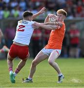 3 June 2023; Conor Turbitt of Armagh is tackled by Michael McKernan of Tyrone during the GAA Football All-Ireland Senior Championship Round 2 match between Tyrone and Armagh at O'Neill's Healy Park in Omagh, Tyrone. Photo by Brendan Moran/Sportsfile