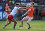 3 June 2023; Conor Turbitt of Armagh is tackled by Michael McKernan of Tyrone during the GAA Football All-Ireland Senior Championship Round 2 match between Tyrone and Armagh at O'Neill's Healy Park in Omagh, Tyrone. Photo by Brendan Moran/Sportsfile