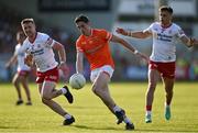 3 June 2023; Rory Grugan of Armagh in action against Michael O’Neil, left, and Michael McKernan of Tyrone of Tyrone during the GAA Football All-Ireland Senior Championship Round 2 match between Tyrone and Armagh at O'Neill's Healy Park in Omagh, Tyrone. Photo by Brendan Moran/Sportsfile