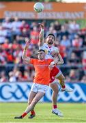 3 June 2023; Pádraig Hampsey of Tyrone and Greg McCabe of Armagh contest a high ball during the GAA Football All-Ireland Senior Championship Round 2 match between Tyrone and Armagh at O'Neill's Healy Park in Omagh, Tyrone. Photo by Brendan Moran/Sportsfile