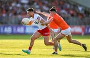 3 June 2023; Michael McKernan of Tyrone is tackled by Conor O'Neill of Armagh during the GAA Football All-Ireland Senior Championship Round 2 match between Tyrone and Armagh at O'Neill's Healy Park in Omagh, Tyrone. Photo by Brendan Moran/Sportsfile