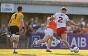 3 June 2023; Michael McKernan of Tyrone clears the ball from the path of Armagh forward Oisin Conaty in the closing moments of the GAA Football All-Ireland Senior Championship Round 2 match between Tyrone and Armagh at O'Neill's Healy Park in Omagh, Tyrone. Photo by Brendan Moran/Sportsfile