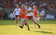 3 June 2023; Darragh Canavan of Tyrone holds off the tackle of Cian McConville of Armagh during the GAA Football All-Ireland Senior Championship Round 2 match between Tyrone and Armagh at O'Neill's Healy Park in Omagh, Tyrone. Photo by Brendan Moran/Sportsfile