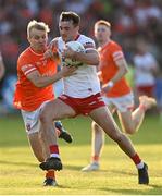 3 June 2023; Darragh Canavan of Tyrone holds off the tackle of Cian McConville of Armagh during the GAA Football All-Ireland Senior Championship Round 2 match between Tyrone and Armagh at O'Neill's Healy Park in Omagh, Tyrone. Photo by Brendan Moran/Sportsfile