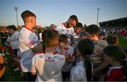 3 June 2023; Ronan McNamee of Tyrone signs autographs for supporters after the GAA Football All-Ireland Senior Championship Round 2 match between Tyrone and Armagh at O'Neill's Healy Park in Omagh, Tyrone. Photo by Brendan Moran/Sportsfile