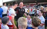 3 June 2023; Darragh Canavan of Tyrone is congratulated by former Tyrone footballer Gerard Cavlan after the GAA Football All-Ireland Senior Championship Round 2 match between Tyrone and Armagh at O'Neill's Healy Park in Omagh, Tyrone. Photo by Brendan Moran/Sportsfile