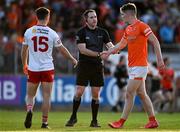 3 June 2023; Referee Martin McNally shakes hands with Jarly Óg Burns of Armagh, right, and Darragh Canavan of Tyrone after the GAA Football All-Ireland Senior Championship Round 2 match between Tyrone and Armagh at O'Neill's Healy Park in Omagh, Tyrone. Photo by Brendan Moran/Sportsfile