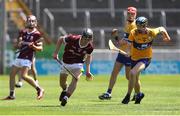 4 June 2023; Colm Burke of Galway in action against Matthew O'Halloran of Clare during the Electric Ireland GAA Hurling All-Ireland Minor Championship Final match between Clare and Galway at FBD Semple Stadium in Thurles, Tipperary. Photo by Michael P Ryan/Sportsfile