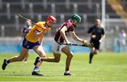 4 June 2023; Aaron Niland of Galway in action against Evan Price of Clare during the Electric Ireland GAA Hurling All-Ireland Minor Championship Final match between Clare and Galway at FBD Semple Stadium in Thurles, Tipperary. Photo by Michael P Ryan/Sportsfile
