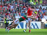 4 June 2023; Tommy Durnin of Louth in action against Jordan Flynn of Mayo during the GAA Football All-Ireland Senior Championship Round 2 match between Mayo and Louth at Hastings Insurance MacHale Park in Castlebar, Mayo. Photo by Seb Daly/Sportsfile