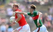 4 June 2023; Conor Grimes of Louth in action against Donnacha McHugh of Mayo during the GAA Football All-Ireland Senior Championship Round 2 match between Mayo and Louth at Hastings Insurance MacHale Park in Castlebar, Mayo. Photo by Seb Daly/Sportsfile