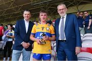 4 June 2023; Pictured are Pat Fenlon of Electric Ireland, left, and Uachtarán Larry McCarthy presenting Eoghan Gunning of Clare with the Electric Ireland Player of the Match award following his performance in the Electric Ireland GAA Hurling All-Ireland Minor Championship Final match between Clare and Galway at FBD Semple Stadium in Thurles, Tipperary. Photo by Michael P Ryan/Sportsfile