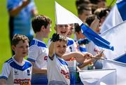 4 June 2023; Jack Horkan, aged 9, from Clones, Monaghan along with his Clones GAA U11 team-mates greet the Monaghan team as they enter the pitch ahead of the GAA Football All-Ireland Senior Championship Round 2 match between Monaghan and Clare at St Tiernach's Park in Clones, Monaghan. Photo by Daire Brennan/Sportsfile