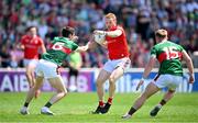 4 June 2023; Donal McKenny of Louth in action against Conor Loftus, left and Ryan O'Donoghue of Mayo during the GAA Football All-Ireland Senior Championship Round 2 match between Mayo and Louth at Hastings Insurance MacHale Park in Castlebar, Mayo. Photo by Seb Daly/Sportsfile