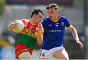 4 June 2023; Jamie Clarke of Carlow in action against Bryan Masterson of Longford during the Tailteann Cup Group 3 Round 3 match between Longford and Carlow at Laois Hire O'Moore Park in Portlaoise, Laois. Photo by Matt Browne/Sportsfile