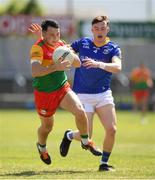 4 June 2023; Jamie Clarke of Carlow in action against Bryan Masterson of Longford during the Tailteann Cup Group 3 Round 3 match between Longford and Carlow at Laois Hire O'Moore Park in Portlaoise, Laois. Photo by Matt Browne/Sportsfile