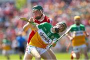 4 June 2023; Adam Screeney of Offaly in action against Shane Kingston of Cork during the O’Neills.com GAA Hurling All-Ireland U20 Championship Final match between Cork and Offaly at FBD Semple Stadium in Thurles, Tipperary. Photo by Michael P Ryan/Sportsfile