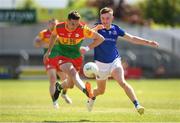 4 June 2023; Jordan Morrissey of Carlow in action against Dessie Reynolds of Longford during the Tailteann Cup Group 3 Round 3 match between Longford and Carlow at Laois Hire O'Moore Park in Portlaoise, Laois. Photo by Matt Browne/Sportsfile