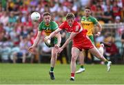 4 June 2023; Brendan Rogers of Derry blocks a shot by Ciaran Thompson of Donegal during the GAA Football All-Ireland Senior Championship Round 2 match between Donegal and Derry at MacCumhaill Park in Ballybofey, Donegal. Photo by Brendan Moran/Sportsfile