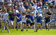 4 June 2023; Young supporters race onto the field at the full time whistle after the GAA Football All-Ireland Senior Championship Round 2 match between Monaghan and Clare at St Tiernach's Park in Clones, Monaghan. Photo by Daire Brennan/Sportsfile