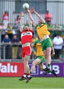 4 June 2023; Conor Glass of Derry and Ciaran Thompson of Donegal contest a kickout during the GAA Football All-Ireland Senior Championship Round 2 match between Donegal and Derry at MacCumhaill Park in Ballybofey, Donegal. Photo by Brendan Moran/Sportsfile