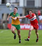 4 June 2023; Jason McGee of Donegal in action against Brendan Rogers of Derry during the GAA Football All-Ireland Senior Championship Round 2 match between Donegal and Derry at MacCumhaill Park in Ballybofey, Donegal. Photo by Brendan Moran/Sportsfile