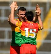 4 June 2023; Carlow players Jamie Clarke, 15, and Darragh Foley celebrate after the Tailteann Cup Group 3 Round 3 match between Longford and Carlow at Laois Hire O'Moore Park in Portlaoise, Laois. Photo by Matt Browne/Sportsfile
