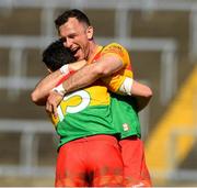 4 June 2023; Carlow players Jamie Clarke, 15, and Darragh Foley celebrate after the Tailteann Cup Group 3 Round 3 match between Longford and Carlow at Laois Hire O'Moore Park in Portlaoise, Laois. Photo by Matt Browne/Sportsfile