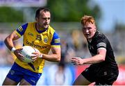 4 June 2023; Donie Smith of Roscommon in action against Evan Lyons of Sligo during the GAA Football All-Ireland Senior Championship Round 2 match between Roscommon and Sligo at Dr Hyde Park in Roscommon. Photo by Piaras Ó Mídheach/Sportsfile