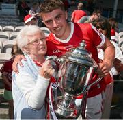 4 June 2023; Cork captain Michael Mullins is congratulated by his grandmother Esther after the O’Neills.com GAA Hurling All-Ireland U20 Championship Final match between Cork and Offaly at FBD Semple Stadium in Thurles, Tipperary. Photo by Michael P Ryan/Sportsfile