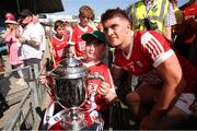 4 June 2023; Michael Mullins of Cork celebrates with a supporter after the O’Neills.com GAA Hurling All-Ireland U20 Championship Final match between Cork and Offaly at FBD Semple Stadium in Thurles, Tipperary. Photo by Michael P Ryan/Sportsfile