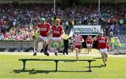 4 June 2023; Cork players including Ben Cunningham, left, and Michael Mullins make their way out for the team photograph before the O’Neills.com GAA Hurling All-Ireland U20 Championship Final match between Cork and Offaly at FBD Semple Stadium in Thurles, Tipperary. Photo by Michael P Ryan/Sportsfile