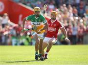 4 June 2023; Conor Doyle of Offaly in action against Michael Mullins of Cork during the O’Neills.com GAA Hurling All-Ireland U20 Championship Final match between Cork and Offaly at FBD Semple Stadium in Thurles, Tipperary. Photo by Michael P Ryan/Sportsfile