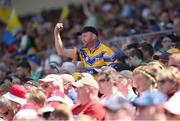 4 June 2023; A Clare supporters celebrates a score during the Electric Ireland GAA Hurling All-Ireland Minor Championship Final match between Clare and Galway at FBD Semple Stadium in Thurles, Tipperary. Photo by Michael P Ryan/Sportsfile