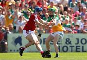 4 June 2023; Adam Screeney of Offaly in action against Darragh O'Sullivan of Cork during the O’Neills.com GAA Hurling All-Ireland U20 Championship Final match between Cork and Offaly at FBD Semple Stadium in Thurles, Tipperary. Photo by Michael P Ryan/Sportsfile
