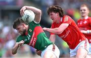 4 June 2023; Pádraig O’Hora of Mayo in action against Ciaran Murphy of Louth during the GAA Football All-Ireland Senior Championship Round 2 match between Mayo and Louth at Hastings Insurance MacHale Park in Castlebar, Mayo. Photo by Seb Daly/Sportsfile