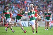 4 June 2023; Conor Grimes of Louth shoots under pressure from Ryan O'Donoghue, right, and Sam Callinan of Mayo during the GAA Football All-Ireland Senior Championship Round 2 match between Mayo and Louth at Hastings Insurance MacHale Park in Castlebar, Mayo. Photo by Seb Daly/Sportsfile