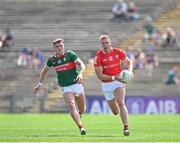 4 June 2023; Conor Grimes of Louth in action against Jordan Flynn of Mayo during the GAA Football All-Ireland Senior Championship Round 2 match between Mayo and Louth at Hastings Insurance MacHale Park in Castlebar, Mayo. Photo by Seb Daly/Sportsfile