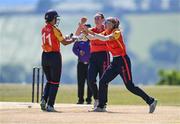 5 June 2023; Polly Inglis of Scorchers, left, celebrates with teammates Sophie MacMahon, centre, and Gaby Lewis after stumping out Robyn Searle during the Evoke Super Series 2023 match between Scorchers and Typhoons at Oak Hill Cricket Club in Kilbride, Wicklow. Photo by Tyler Miller/Sportsfile
