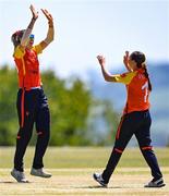5 June 2023; Aimee Maguire of Scorchers, right, celebrates with teammate Gaby Lewis after catching out Ava Canning of Typhoons during the Evoke Super Series 2023 match between Scorchers and Typhoons at Oak Hill Cricket Club in Kilbride, Wicklow. Photo by Tyler Miller/Sportsfile