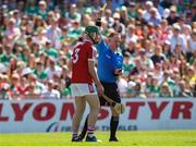 4 June 2023; Shane Kingston of Cork is shown a yellow card by referee Chris Mooney during the O’Neills.com GAA Hurling All-Ireland U20 Championship Final match between Cork and Offaly at FBD Semple Stadium in Thurles, Tipperary. Photo by Michael P Ryan/Sportsfile
