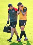 5 June 2023; Patrick McEleney of Derry City leaves the field with an injury, accompanied by Derry physiotherapist Michael Hegarty, during the SSE Airtricity Men's Premier Division match between St Patrick's Athletic and Derry City at Richmond Park in Dublin. Photo by Harry Murphy/Sportsfile