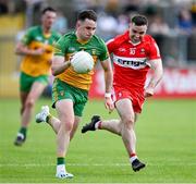 4 June 2023; Caolan McColgan of Donegal in action against Niall Toner of Derry during the GAA Football All-Ireland Senior Championship Round 2 match between Donegal and Derry at MacCumhaill Park in Ballybofey, Donegal. Photo by Brendan Moran/Sportsfile