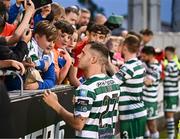 9 June 2023; Liam Burt of Shamrock Rovers and teammates sign autographs after their side's victory in the SSE Airtricity Men's Premier Division match between Shamrock Rovers and UCD at Tallaght Stadium in Dublin. Photo by Harry Murphy/Sportsfile