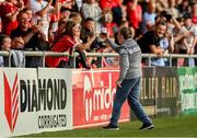 9 June 2023; Bohemians supporter Barry Lenihan celebrates with Derry City supporters after scoring a penalty on the pitch at half time during the SSE Airtricity Men's Premier Division match between Derry City and Bohemians at The Ryan McBride Brandywell Stadium in Derry. Photo by Seb Daly/Sportsfile