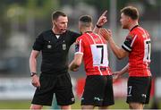 9 June 2023; Referee Damien MacGraith talks to Derry City players Michael Duffy, 7, and Cameron McJannet during the SSE Airtricity Men's Premier Division match between Derry City and Bohemians at The Ryan McBride Brandywell Stadium in Derry. Photo by Seb Daly/Sportsfile