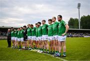 10 June 2023; Sean Quigley of Fermanagh, right, and teammates stand for Amhrán na bhFiann before the Tailteann Cup Preliminary Quarter Final match between Fermanagh and Laois at Brewster Park in Enniskillen, Fermanagh. Photo by David Fitzgerald/Sportsfile