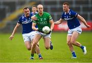 10 June 2023; Lee Cullen of Fermanagh in action against Eoin Lowry, left, and Colm Murphy of Laois during the Tailteann Cup Preliminary Quarter Final match between Fermanagh and Laois at Brewster Park in Enniskillen, Fermanagh. Photo by David Fitzgerald/Sportsfile